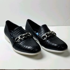 Calvin Klein Banda lizard patterned black loafer with a chain detail.